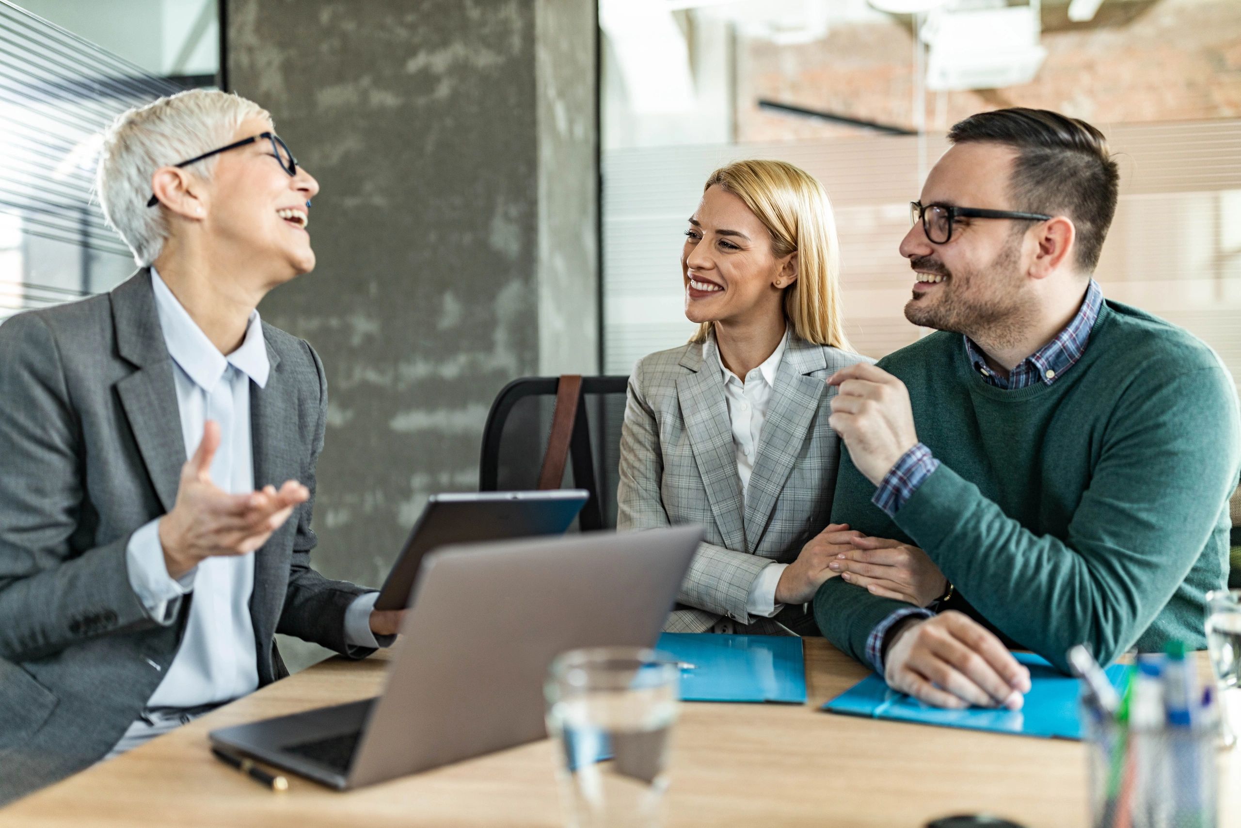 Clients meeting with a professional advisor in an office