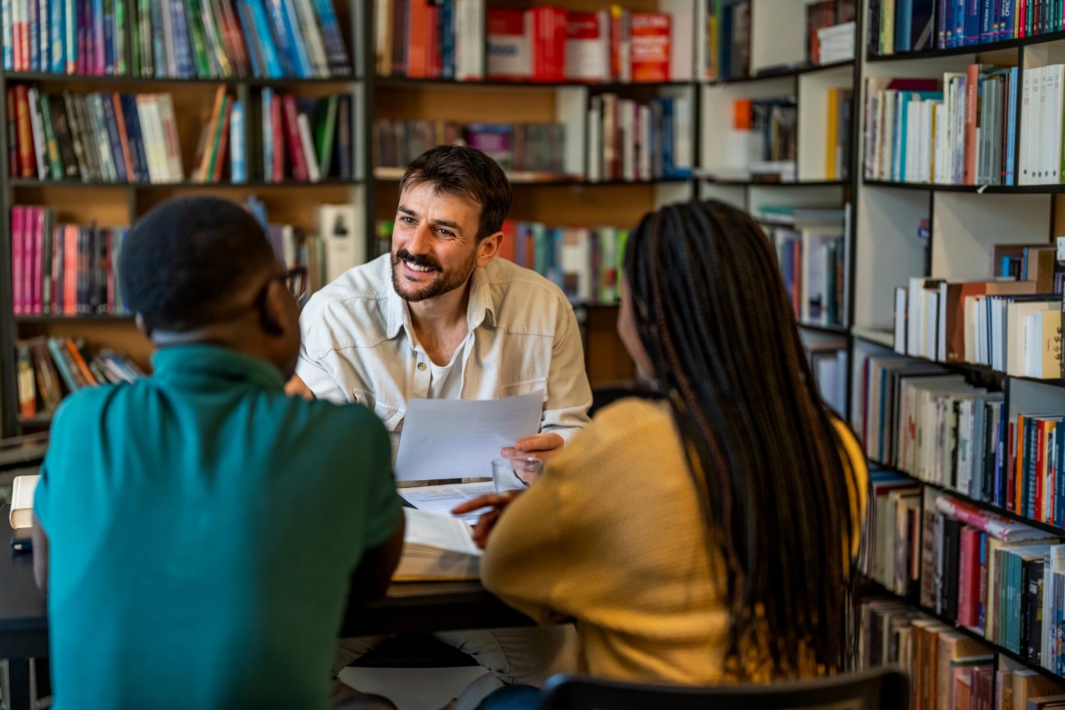 Financial advisor consulting with clients in a professional office